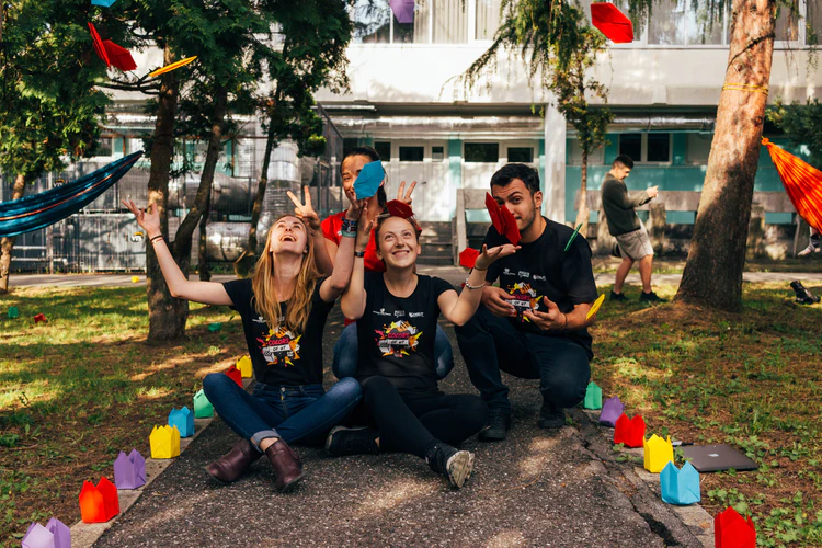 Group of people throwing confetti